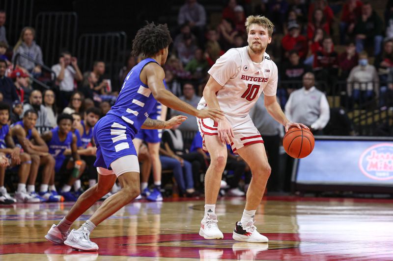 Nov 26, 2022; Piscataway, New Jersey, USA; Rutgers Scarlet Knights guard Cam Spencer (10) dribbles as Central Connecticut State Blue Devils guard Jay Rodgers (1) defends during the second half at Jersey Mike's Arena. Mandatory Credit: Vincent Carchietta-USA TODAY Sports