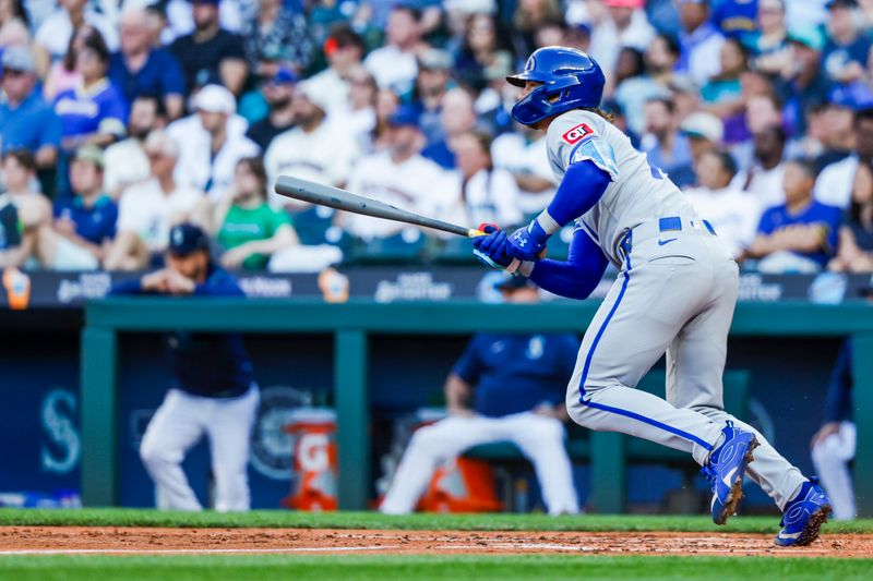 Jun 30, 2025; Seattle, Washington, USA; Kansas City Royals shortstop Bobby Witt Jr. (7) hits an RBI-single against the Seattle Mariners during the third inning at T-Mobile Park. Mandatory Credit: Joe Nicholson-Imagn Images