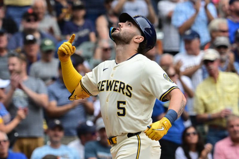 Aug 29, 2024; Milwaukee, Wisconsin, USA; Milwaukee Brewers right fielder Garrett Mitchell (5) reacts after hitting a solo home run in the second inning against the San Francisco Giants  at American Family Field. Mandatory Credit: Benny Sieu-USA TODAY Sports