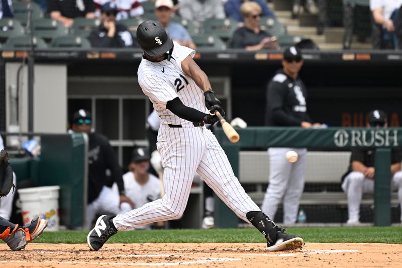 Jun 5, 2025; Chicago, Illinois, USA;  Chicago White Sox outfielder Michael A. Taylor (21) singles against the Detroit Tigers during the fourth inning at Rate Field. Mandatory Credit: Matt Marton-Imagn Images