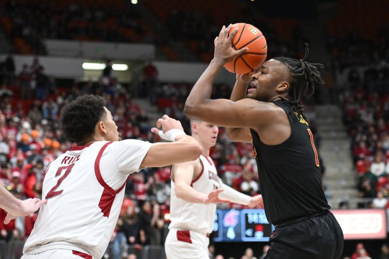 Feb 29, 2024; Pullman, Washington, USA; USC Trojans guard Kobe Johnson (0) shoots the ball against Washington State Cougars guard Myles Rice (2) in the first half at Friel Court at Beasley Coliseum. Mandatory Credit: James Snook-USA TODAY Sports