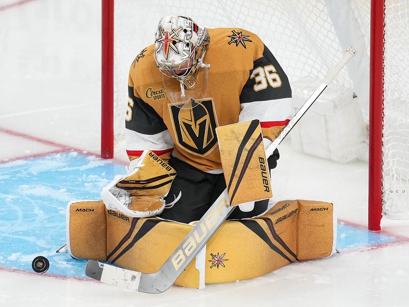 Sep 28, 2022; Las Vegas, Nevada, USA; Vegas Golden Knights goaltender Logan Thompson (36) makes a third period save against the Colorado Avalanche during a preseason game at T-Mobile Arena. Mandatory Credit: Stephen R. Sylvanie-USA TODAY Sports