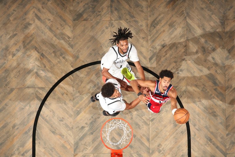 BROOKLYN, NY - OCTOBER 14: Jordan Poole #13 of the Washington Wizards drives to the basket during the game against the Brooklyn Nets during a NBA preseason game on October 14, 2024 at Barclays Center in Brooklyn, New York. NOTE TO USER: User expressly acknowledges and agrees that, by downloading and or using this Photograph, user is consenting to the terms and conditions of the Getty Images License Agreement. Mandatory Copyright Notice: Copyright 2024 NBAE (Photo by Nathaniel S. Butler/NBAE via Getty Images)