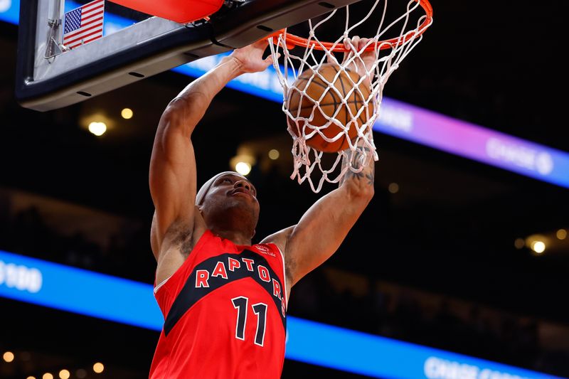 ATLANTA, GEORGIA - FEBRUARY 23: Bruce Brown #11 of the Toronto Raptors dunks during the fourth quarter against the Atlanta Hawks at State Farm Arena on February 23, 2024 in Atlanta, Georgia. NOTE TO USER: User expressly acknowledges and agrees that, by downloading and or using this photograph, User is consenting to the terms and conditions of the Getty Images License Agreement. (Photo by Todd Kirkland/Getty Images)