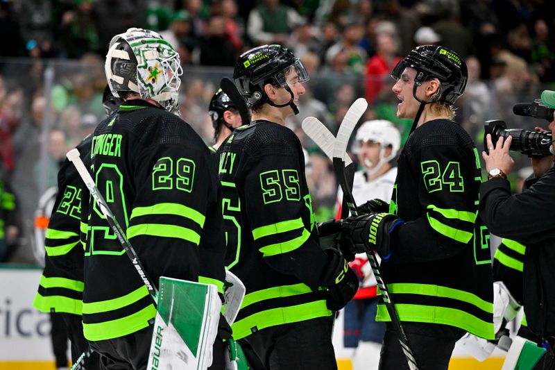 Jan 27, 2024; Dallas, Texas, USA; Dallas Stars goaltender Jake Oettinger (29) and defenseman Thomas Harley (55) and center Roope Hintz (24) celebrate after Harley scores the game wining goal during the overtime period as the Stars defeat the Washington Capitals at the American Airlines Center. Mandatory Credit: Jerome Miron-USA TODAY Sports