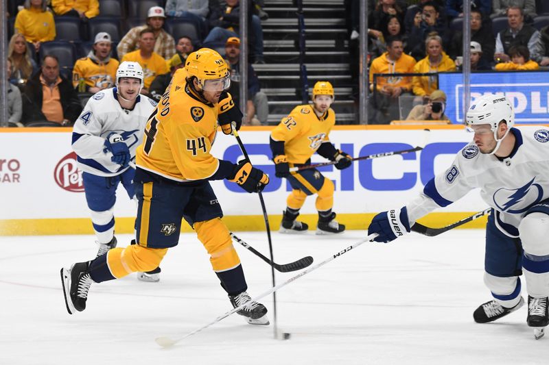 Dec 7, 2023; Nashville, Tennessee, USA; Nashville Predators left wing Kiefer Sherwood (44) shoots the puck during the first period against the Tampa Bay Lightning at Bridgestone Arena. Mandatory Credit: Christopher Hanewinckel-USA TODAY Sports