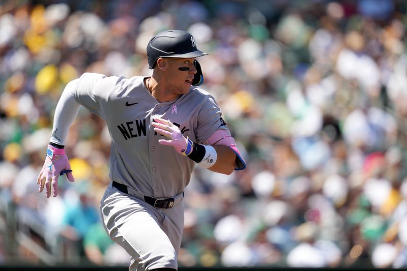 May 11, 2025; West Sacramento, California, USA; New York Yankees right fielder Aaron Judge (99) runs towards first after hitting a double against the Athletics in the fourth inning at Sutter Health Park. Mandatory Credit: Cary Edmondson-Imagn Images