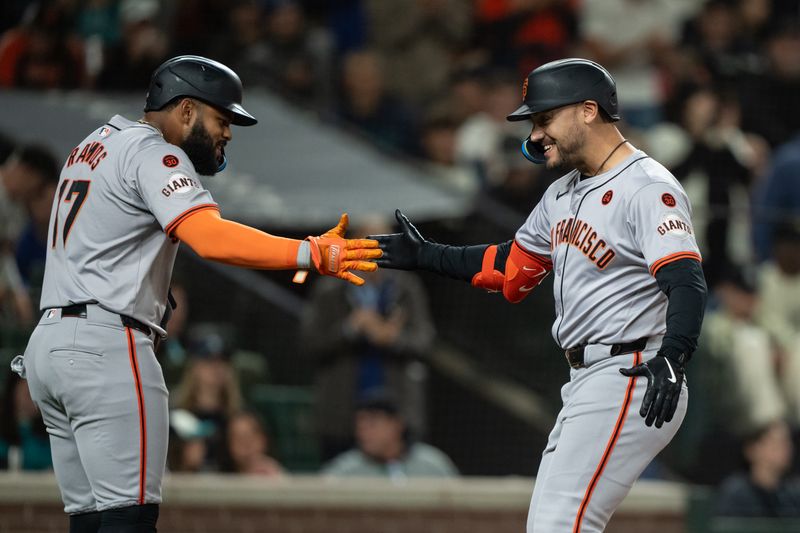 Aug 23, 2024; Seattle, Washington, USA; San Francisco Giants designated hitter Michael Conforto (8) is congratulated by left fielder Heliot Ramos (17) after hitting a two-run home run during the fourth inning against the Seattle Mariners at T-Mobile Park. Mandatory Credit: Stephen Brashear-USA TODAY Sports