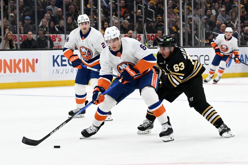 Nov 9, 2023; Boston, Massachusetts, USA; New York Islanders defenseman Ryan Pulock (6) controls the puck against Boston Bruins left wing Brad Marchand (63) during the first period at the TD Garden. Mandatory Credit: Brian Fluharty-USA TODAY Sports