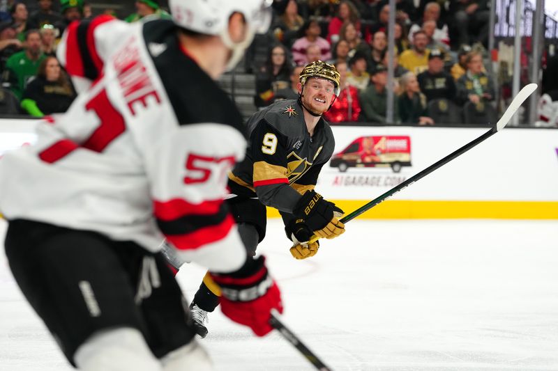 Mar 17, 2024; Las Vegas, Nevada, USA; Vegas Golden Knights center Jack Eichel (9) keeps pace with New Jersey Devils defenseman Nick DeSimone (57) during the third period at T-Mobile Arena. Mandatory Credit: Stephen R. Sylvanie-USA TODAY Sports