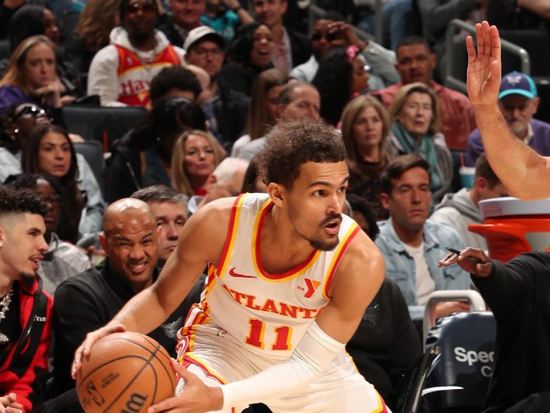 CHARLOTTE, NC - FEBRUARY 14: Trae Young #11 of the Atlanta Hawks looks to pass the ball during the game against the Charlotte Hornets on February 14, 2024 at Spectrum Center in Charlotte, North Carolina. NOTE TO USER: User expressly acknowledges and agrees that, by downloading and or using this photograph, User is consenting to the terms and conditions of the Getty Images License Agreement. Mandatory Copyright Notice: Copyright 2024 NBAE (Photo by Kent Smith/NBAE via Getty Images)