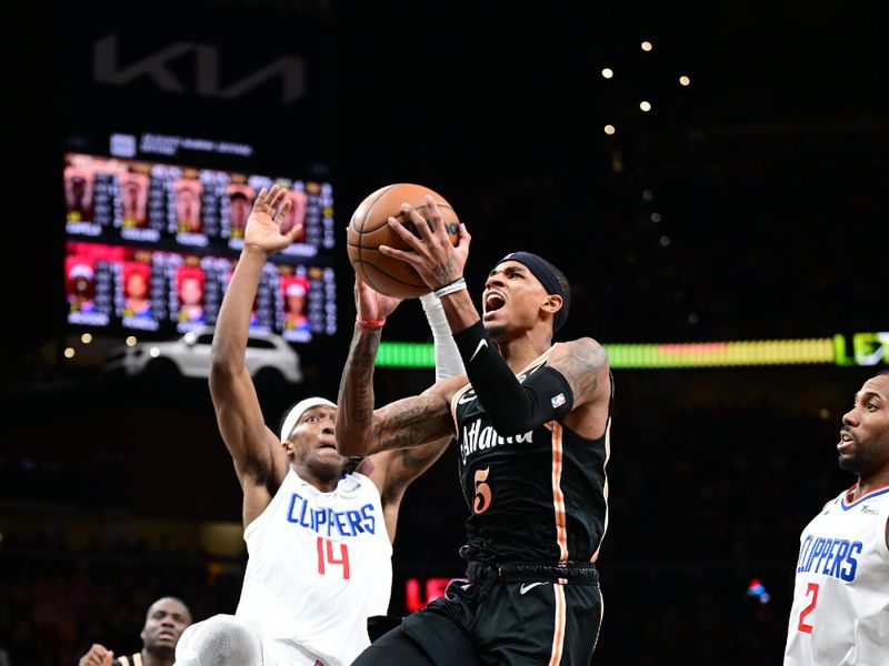 ATLANTA, GA - JANUARY 28: Dejounte Murray #5 of the Atlanta Hawks drives to the basket during the game on January 28, 2023 at State Farm Arena in Atlanta, Georgia.  NOTE TO USER: User expressly acknowledges and agrees that, by downloading and/or using this Photograph, user is consenting to the terms and conditions of the Getty Images License Agreement. Mandatory Copyright Notice: Copyright 2023 NBAE (Photo by Adam Hagy/NBAE via Getty Images)