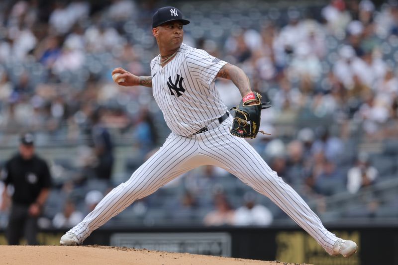 May 23, 2024; Bronx, New York, USA; New York Yankees starting pitcher Luis Gil (81) pitches against the Seattle Mariners during the second inning at Yankee Stadium. Mandatory Credit: Brad Penner-USA TODAY Sports