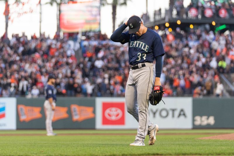 Jul 3, 2023; San Francisco, California, USA;  Seattle Mariners starting pitcher Bryan Woo (33) reacts during the fourth inning against the San Francisco Giants at Oracle Park. Mandatory Credit: Stan Szeto-USA TODAY Sports