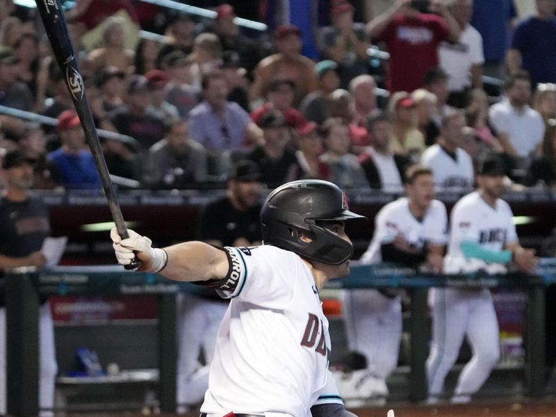 Jul 8, 2023; Phoenix, Arizona, USA; Arizona Diamondbacks left fielder Corbin Carroll (7) hits a walk off RBI single against the Pittsburgh Pirates during the tenth inning at Chase Field. Mandatory Credit: Joe Camporeale-USA TODAY Sports