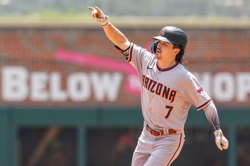 Jul 20, 2023; Cumberland, Georgia, USA; Arizona Diamondbacks left fielder Corbin Carroll (7) reacts after hitting a home run against the Atlanta Braves during the eighth inning at Truist Park. Mandatory Credit: Dale Zanine-USA TODAY Sports