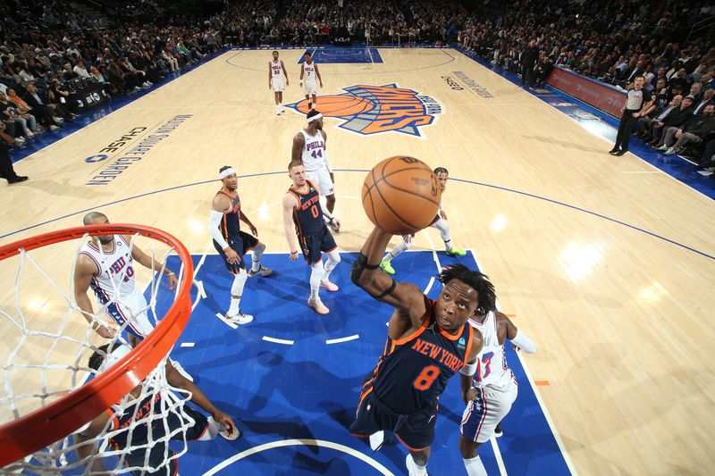 NEW YORK, NY - MARCH 12: OG Anunoby #8 of the New York Knicks rebounds the ball during the game against the Philadelphia 76ers on March 12, 2024 at Madison Square Garden in New York City, New York.  NOTE TO USER: User expressly acknowledges and agrees that, by downloading and or using this photograph, User is consenting to the terms and conditions of the Getty Images License Agreement. Mandatory Copyright Notice: Copyright 2024 NBAE  (Photo by Nathaniel S. Butler/NBAE via Getty Images)