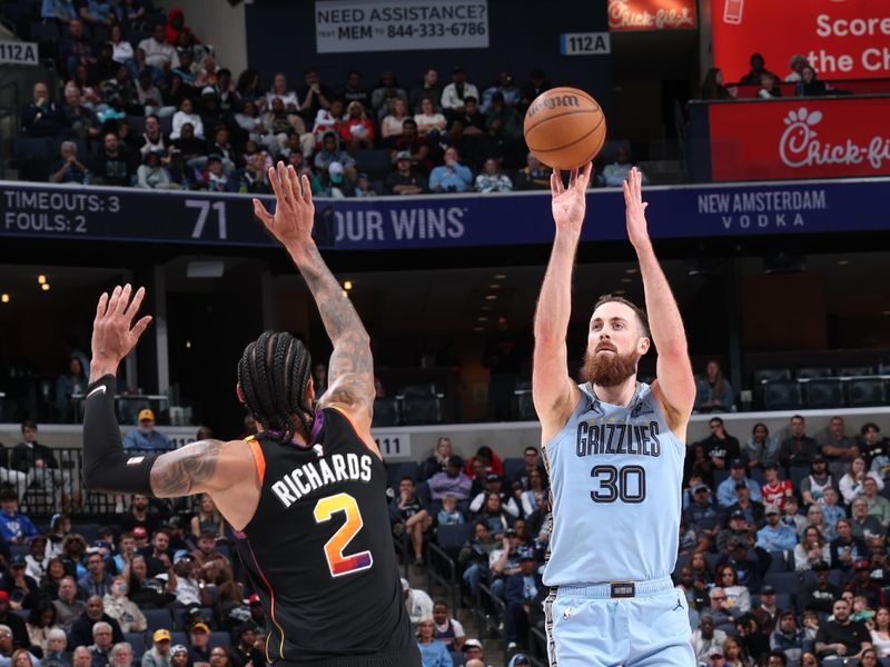 MEMPHIS, TN - MARCH 10: Jay Huff #30 of the Memphis Grizzlies shoots the ball during the game against the Phoenix Suns on March 10, 2025 at FedExForum in Memphis, Tennessee. NOTE TO USER: User expressly acknowledges and agrees that, by downloading and or using this photograph, User is consenting to the terms and conditions of the Getty Images License Agreement. Mandatory Copyright Notice: Copyright 2025 NBAE (Photo by Joe Murphy/NBAE via Getty Images)