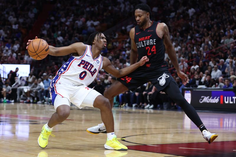 MIAMI, FLORIDA - APRIL 04: Tyrese Maxey #0 of the Philadelphia 76ers drives against Haywood Highsmith #24 of the Miami Heat during the fourth quarter of the game at Kaseya Center on April 04, 2024 in Miami, Florida. NOTE TO USER: User expressly acknowledges and agrees that, by downloading and or using this photograph, User is consenting to the terms and conditions of the Getty Images License Agreement. (Photo by Megan Briggs/Getty Images)