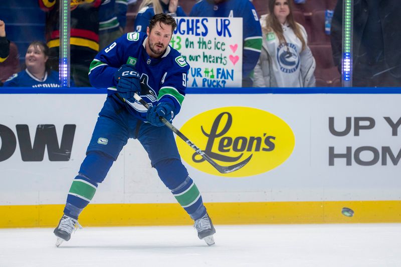 Nov 12, 2024; Vancouver, British Columbia, CAN; Vancouver Canucks forward J.T. Miller (9) warms up prior to a game against the Calgary Flames at Rogers Arena. Mandatory Credit: Bob Frid-Imagn Images