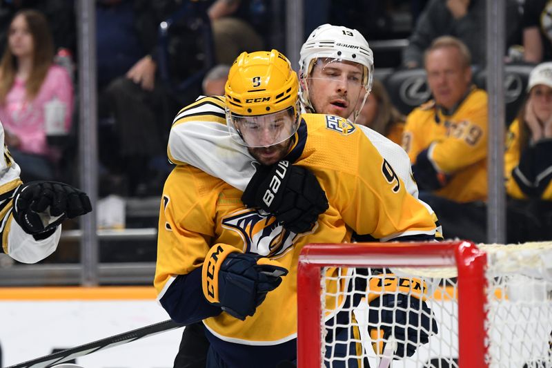 Apr 2, 2024; Nashville, Tennessee, USA; Nashville Predators left wing Filip Forsberg (9) is grabbed by Boston Bruins center Charlie Coyle (13) after the whistle during the third period at Bridgestone Arena. Mandatory Credit: Christopher Hanewinckel-USA TODAY Sports