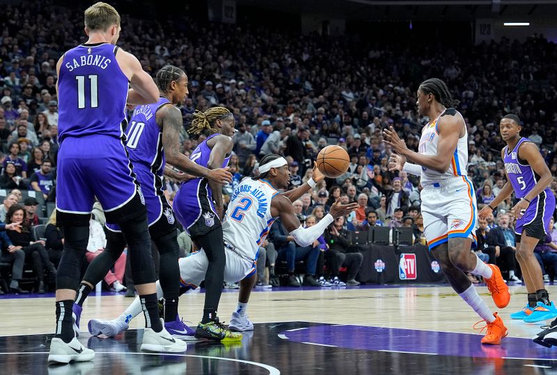 SACRAMENTO, CALIFORNIA - NOVEMBER 25: Shai Gilgeous-Alexander #2 of the Oklahoma City Thunder passes the ball to Jalen Williams #8 against the Sacramento Kings during the first quarter at Golden 1 Center on November 25, 2024 in Sacramento, California. Gilgeous-Alexander was called for three-second violation in the key. NOTE TO USER: User expressly acknowledges and agrees that, by downloading and or using this photograph, User is consenting to the terms and conditions of the Getty Images License Agreement. (Photo by Thearon W. Henderson/Getty Images)