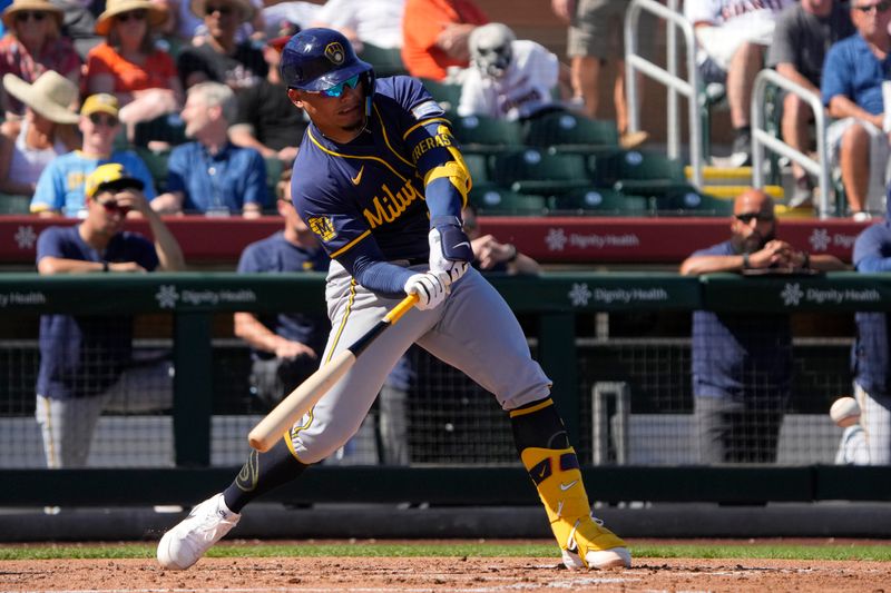 Mar 5, 2024; Scottsdale, Arizona, USA; Milwaukee Brewers catcher Willie Contreras (24) hits against the San Francisco Giants in the second inning at Scottsdale Stadium. Mandatory Credit: Rick Scuteri-USA TODAY Sports