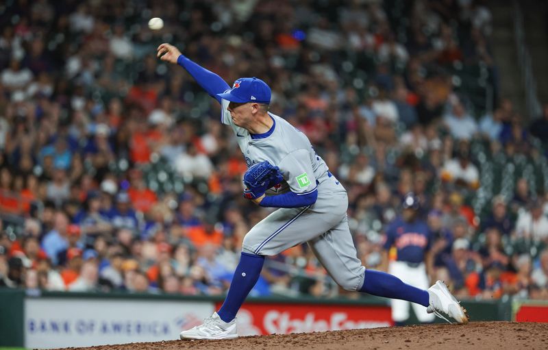 Apr 2, 2024; Houston, Texas, USA; Toronto Blue Jays relief pitcher Chad Green (57) delivers a pitch during the ninth inning against the Houston Astros at Minute Maid Park. Mandatory Credit: Troy Taormina-USA TODAY Sports