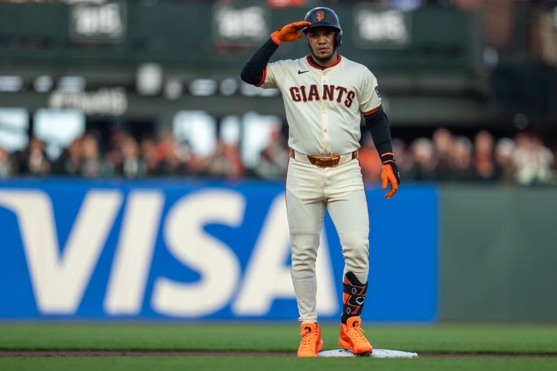 May 13, 2024; San Francisco, California, USA; San Francisco Giants second baseman Thairo Estrada (39) celebrates after hitting a double against the Los Angeles Dodgers during the first inning at Oracle Park. Mandatory Credit: Neville E. Guard-USA TODAY Sports