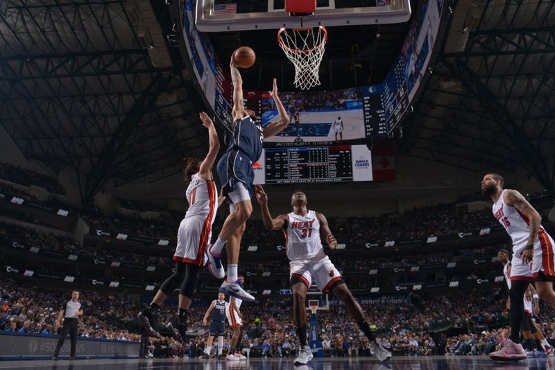 DALLAS, TX - MARCH 7: Dereck Lively II #2 of the Dallas Mavericks dunks the ball during the game against the Miami Heat on March 7, 2024 at the American Airlines Center in Dallas, Texas. NOTE TO USER: User expressly acknowledges and agrees that, by downloading and or using this photograph, User is consenting to the terms and conditions of the Getty Images License Agreement. Mandatory Copyright Notice: Copyright 2024 NBAE (Photo by Glenn James/NBAE via Getty Images)