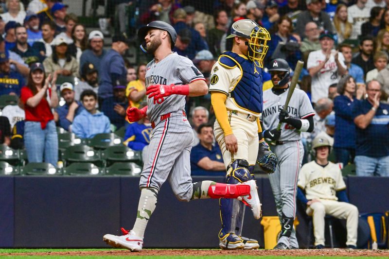 May 17, 2025; Milwaukee, Wisconsin, USA;  Minnesota Twins second baseman Kody Clemens (18) scores after hitting a solo home run as Milwaukee Brewers catcher William Contreras (24) looks on in the fifth inning at American Family Field. Mandatory Credit: Benny Sieu-Imagn Images