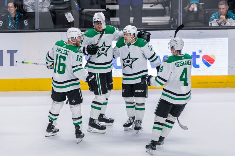 Mar 5, 2024; San Jose, California, USA; Dallas Stars left wing Jamie Benn (14) is congratulated by teammates after he scored the winning goal against the San Jose Sharks during the first overtime period at SAP Center at San Jose. Mandatory Credit: John Hefti-USA TODAY Sports