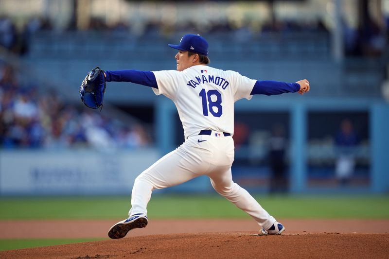 Jun 15, 2024; Los Angeles, California, USA; Los Angeles Dodgers starting pitcher Yoshinobu Yamamoto (18) throws in the first inning against the Kansas City Royals at Dodger Stadium. Mandatory Credit: Kirby Lee-USA TODAY Sports