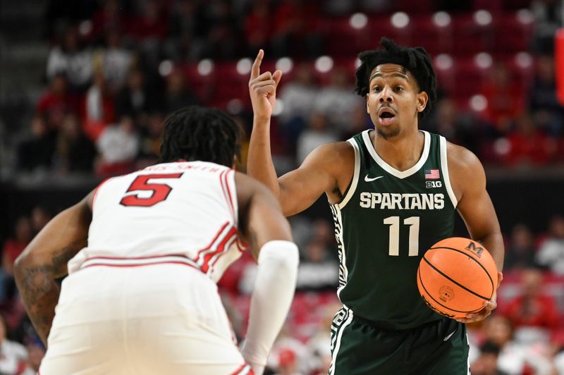 Jan 21, 2024; College Park, Maryland, USA; Michigan State Spartans guard A.J. Hoggard (11) calls the offense during the first half against the Michigan State Spartans  at Xfinity Center. Mandatory Credit: Tommy Gilligan-USA TODAY Sports