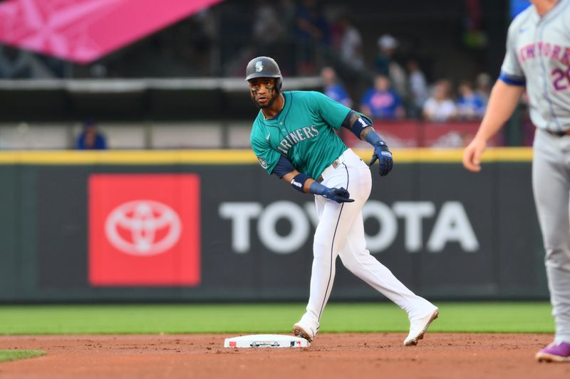 Aug 10, 2024; Seattle, Washington, USA; Seattle Mariners center fielder Victor Robles (10) celebrates after hitting a double against the New York Mets during the first inning at T-Mobile Park. Mandatory Credit: Steven Bisig-USA TODAY Sports