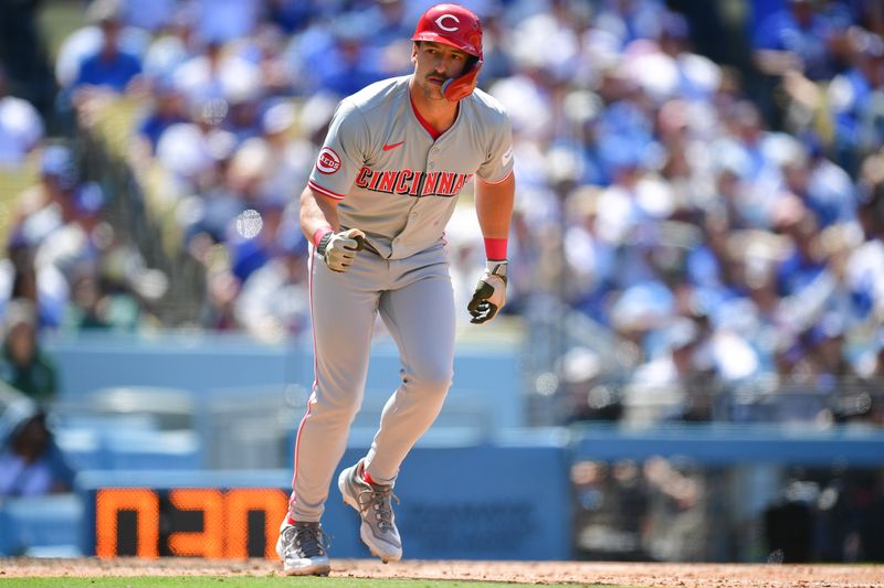 May 19, 2024; Los Angeles, California, USA; Cincinnati Reds outfielder Spencer Steer (7) reacts after drawing a walk with bases loaded against the Los Angeles Dodgers during the seventh inning at Dodger Stadium. Mandatory Credit: Gary A. Vasquez-USA TODAY Sports