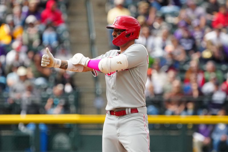 May 14, 2023; Denver, Colorado, USA; Philadelphia Phillies right fielder Nick Castellanos (8) reacts to reaching second on a throwing error in the sixth inning against the Colorado Rockies at Coors Field. Mandatory Credit: Ron Chenoy-USA TODAY Sports