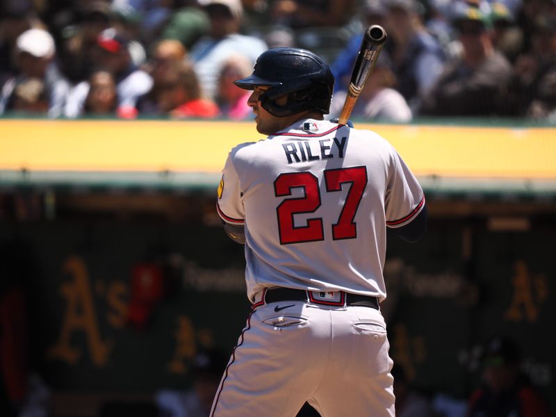 May 31, 2023; Oakland, California, USA; Atlanta Braves third baseman Austin Riley (27) at bat before being hit-by-pitch with bases loaded to send in a run against the Oakland Athletics during the fifth inning at Oakland-Alameda County Coliseum. Mandatory Credit: Kelley L Cox-USA TODAY Sports