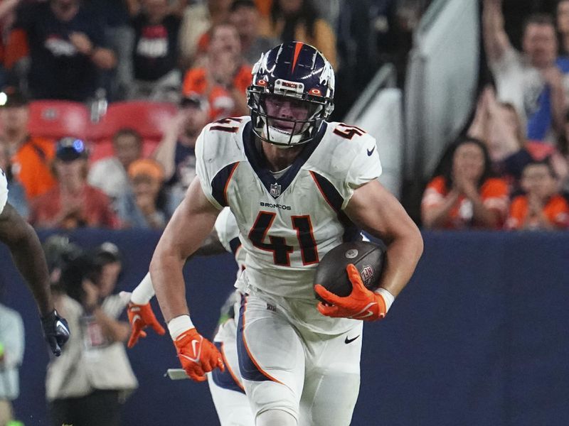 Denver Broncos linebacker Drew Sanders (41) intercepts the ball against the Los Angeles Rams of an NFL football game Saturday, Aug 26, 2023, in Denver. (AP Photo/Bart Young)