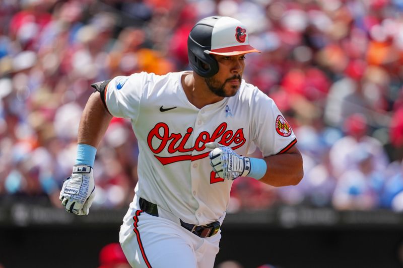 Jun 16, 2024; Baltimore, Maryland, USA; Baltimore Orioles right fielder Anthony Santander (25) runs out an RBI single against the Philadelphia Phillies during the fifth inning at Oriole Park at Camden Yards. Mandatory Credit: Gregory Fisher-USA TODAY Sports