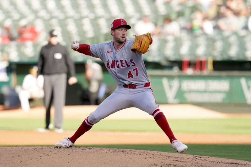 Jul 19, 2024; Oakland, California, USA; Los Angeles Angels pitcher Griffin Canning (47) delivers a pitch against the Oakland Athletics in the first inning at Oakland-Alameda County Coliseum. Mandatory Credit: Cary Edmondson-USA TODAY Sports