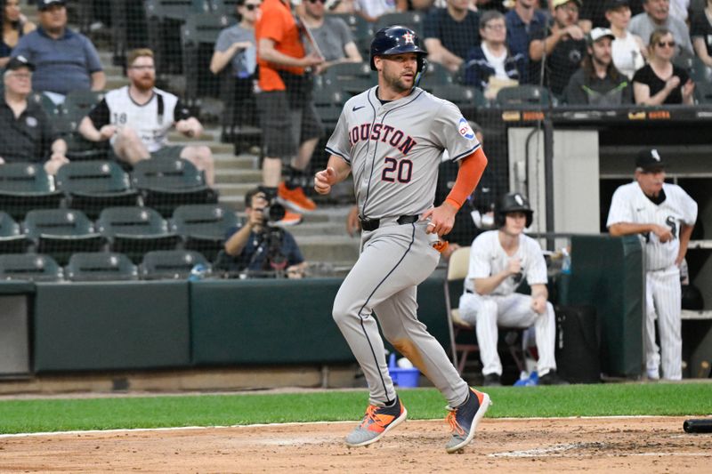 Jun 19, 2024; Chicago, Illinois, USA;  Houston Astros outfielder Chas McCormick (20) scores against the Chicago White Sox during the third inning at Guaranteed Rate Field. Mandatory Credit: Matt Marton-USA TODAY Sports