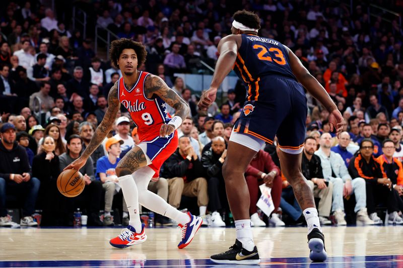 NEW YORK, NEW YORK - APRIL 22: Kelly Oubre Jr. #9 of the Philadelphia 76ers dribbles against Mitchell Robinson #23 of the New York Knicks during the first half in Game Two of the Eastern Conference First Round Playoffs at Madison Square Garden on April 22, 2024 in New York City. NOTE TO USER: User expressly acknowledges and agrees that, by downloading and or using this photograph, User is consenting to the terms and conditions of the Getty Images License Agreement. (Photo by Sarah Stier/Getty Images)