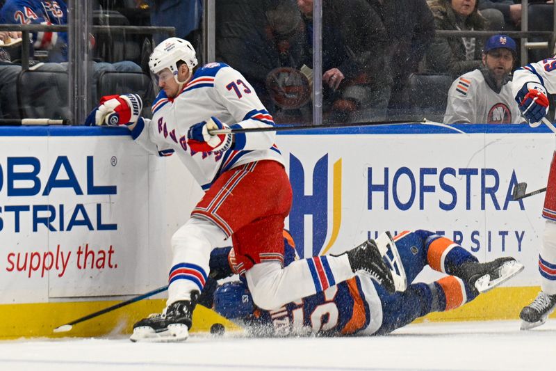 Jan 28, 2026; Elmont, New York, USA;  New York Rangers center Matt Rempe (73) skates into New York Islanders center Casey Cizikas (53) during the second period at UBS Arena. Mandatory Credit: Dennis Schneidler-Imagn Images