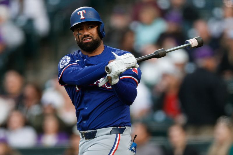 May 10, 2024; Denver, Colorado, USA; Texas Rangers left fielder Ezequiel Duran (20) on deck in the fifth inning against the Colorado Rockies at Coors Field. Mandatory Credit: Isaiah J. Downing-USA TODAY Sports