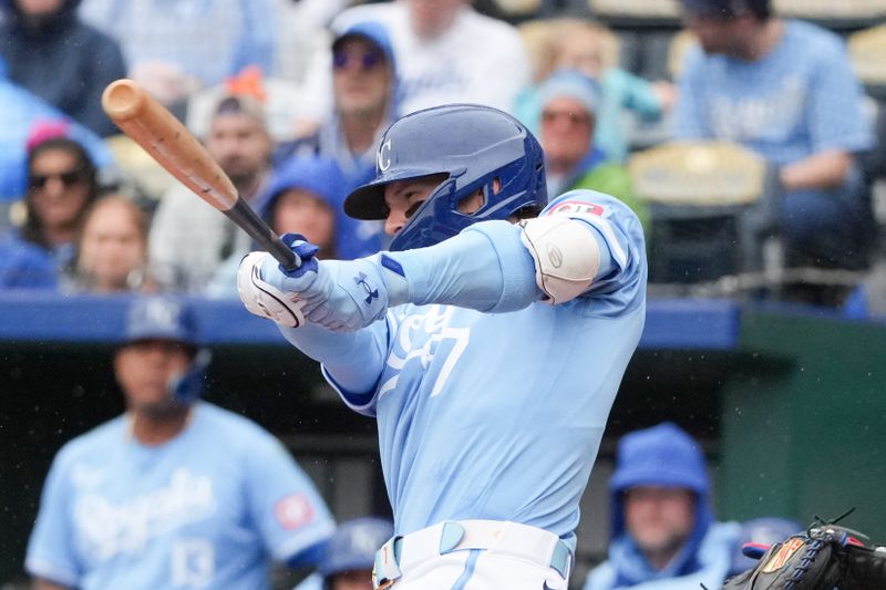 May 5, 2024; Kansas City, Missouri, USA; Kansas City Royals shortstop Bobby Witt Jr. (7) connects for a triple against the Texas Rangers in the first inning at Kauffman Stadium. Mandatory Credit: Denny Medley-USA TODAY Sports