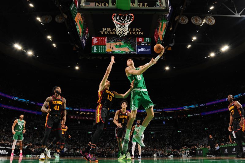 BOSTON, MA - FEBRUARY 7: Kristaps Porzingis #8 of the Boston Celtics drives to the basket during the game against the Atlanta Hawks on February 7, 2024 at the TD Garden in Boston, Massachusetts. NOTE TO USER: User expressly acknowledges and agrees that, by downloading and or using this photograph, User is consenting to the terms and conditions of the Getty Images License Agreement. Mandatory Copyright Notice: Copyright 2024 NBAE  (Photo by Brian Babineau/NBAE via Getty Images)