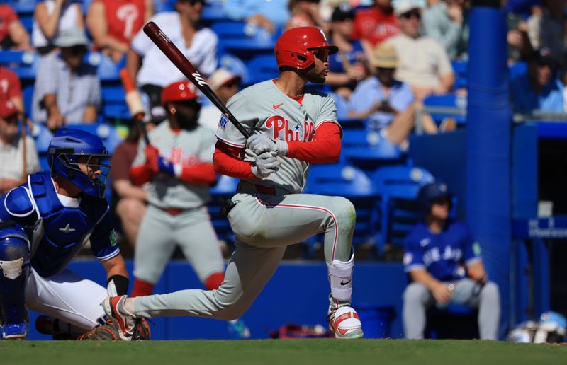 Feb 21, 2026; Dunedin, Florida, USA; Philadelphia Phillies outfielder Justin Crawford (80) singles during the fifth inning against the Toronto Blue Jays  at TD Ballpark. Mandatory Credit: Kim Klement Neitzel-Imagn Images