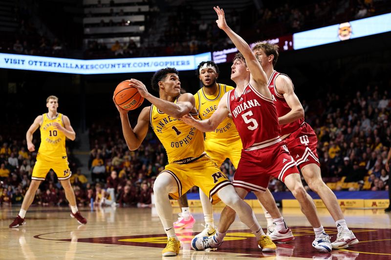 Dec 3, 2025; Minneapolis, Minnesota, USA; Minnesota Golden Gophers guard Isaac Asuma (1) looks to shoot as Indiana Hoosiers guard Conor Enright (5) defends during the first half at Williams Arena. Mandatory Credit: Matt Krohn-Imagn Images
