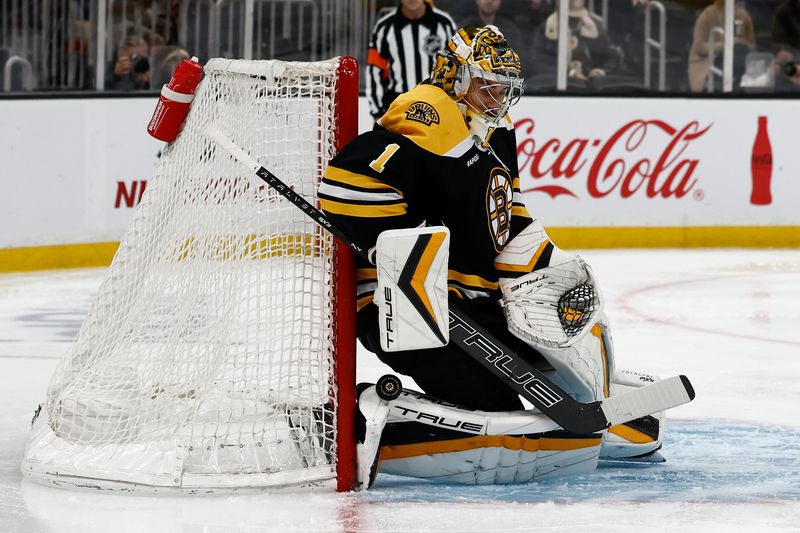 Nov 29, 2024; Boston, Massachusetts, USA; Boston Bruins goaltender Jeremy Swayman (1) makes a save against the post against the Pittsburgh Penguins during the second period at TD Garden. Mandatory Credit: Winslow Townson-Imagn Images